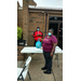 A lady getting meals from the Emergency Distribution.